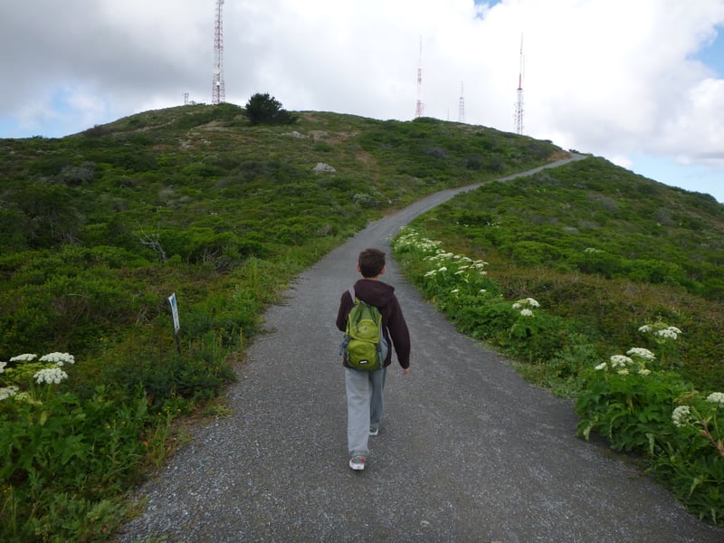 Hiker returning uphill to the trailhead